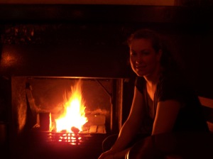 Michelle cozy by fire in the Spaniard